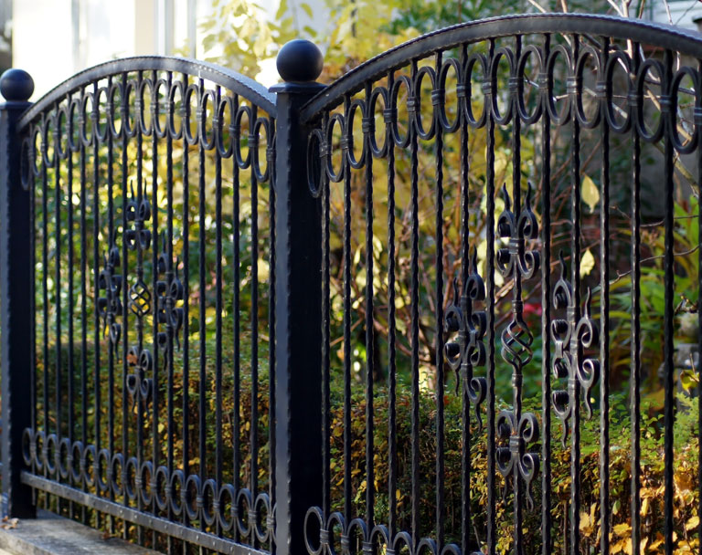 Iron Fence on side of business